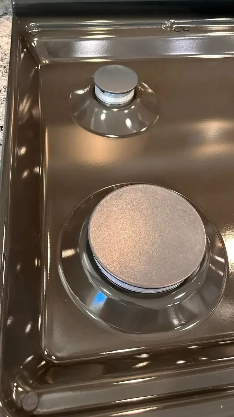 After: the same burner area scrubbed back to clean stainless steel