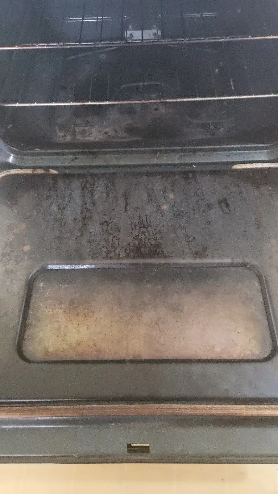 Before: inside of an oven coated in dark baked-on grime