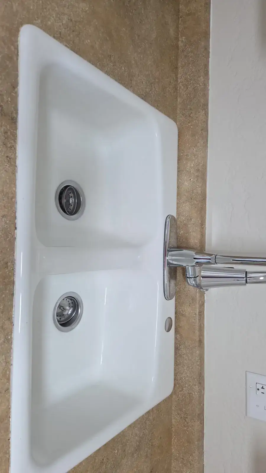 After: the same sink scrubbed bright white